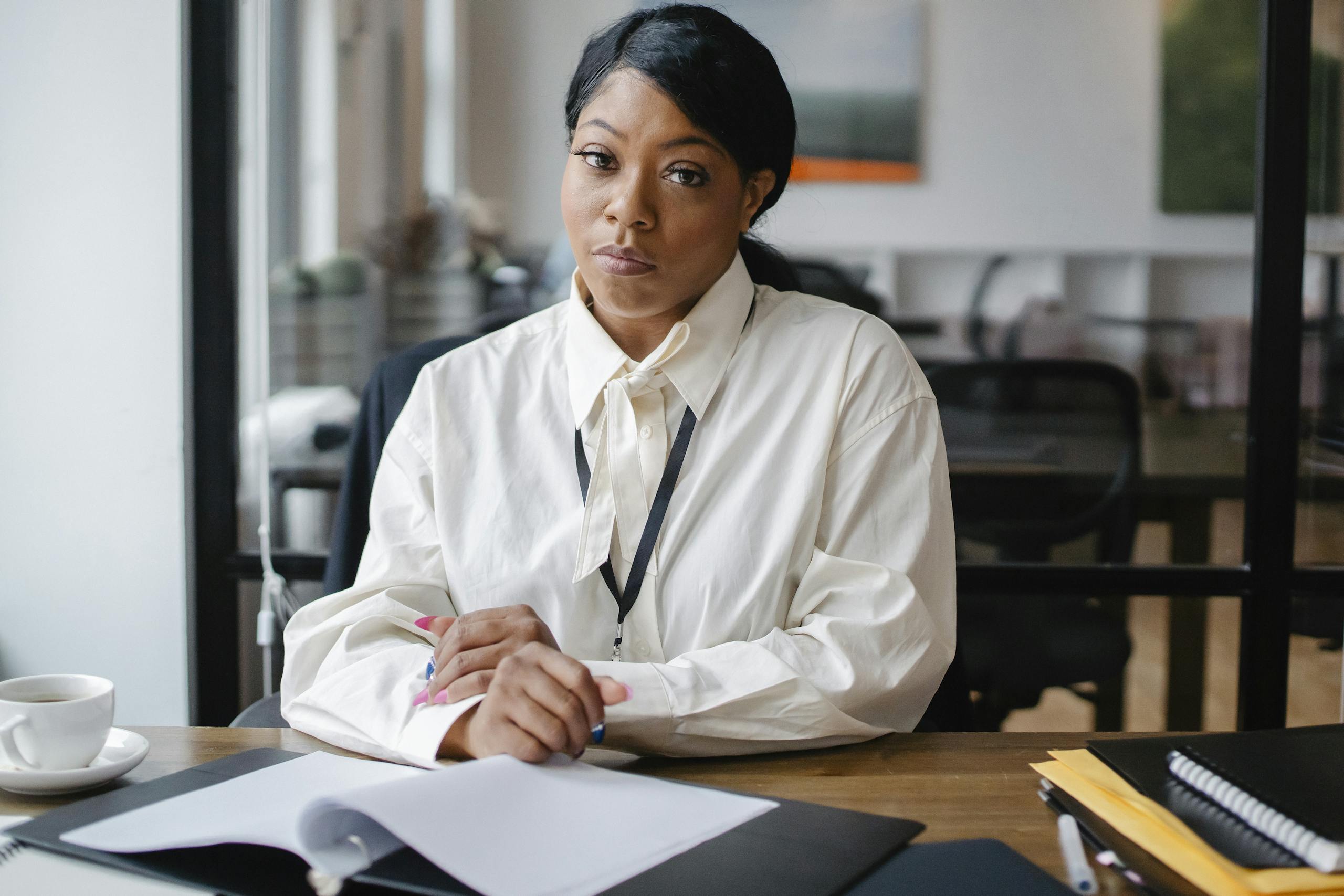 confident businesswoman working at her desk in a modern office setting focusing on an important task. 5669603 scaled, TAG: Employment and HR Solutions