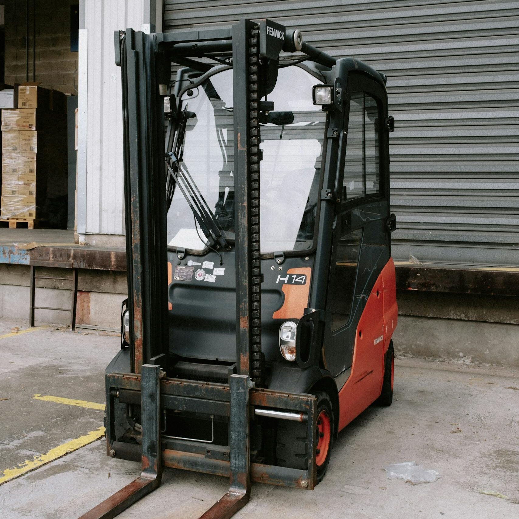 close up of a parked forklift in an industrial warehouse dock area. 11666905 scaled e1738945352765, TAG: Employment and HR Solutions